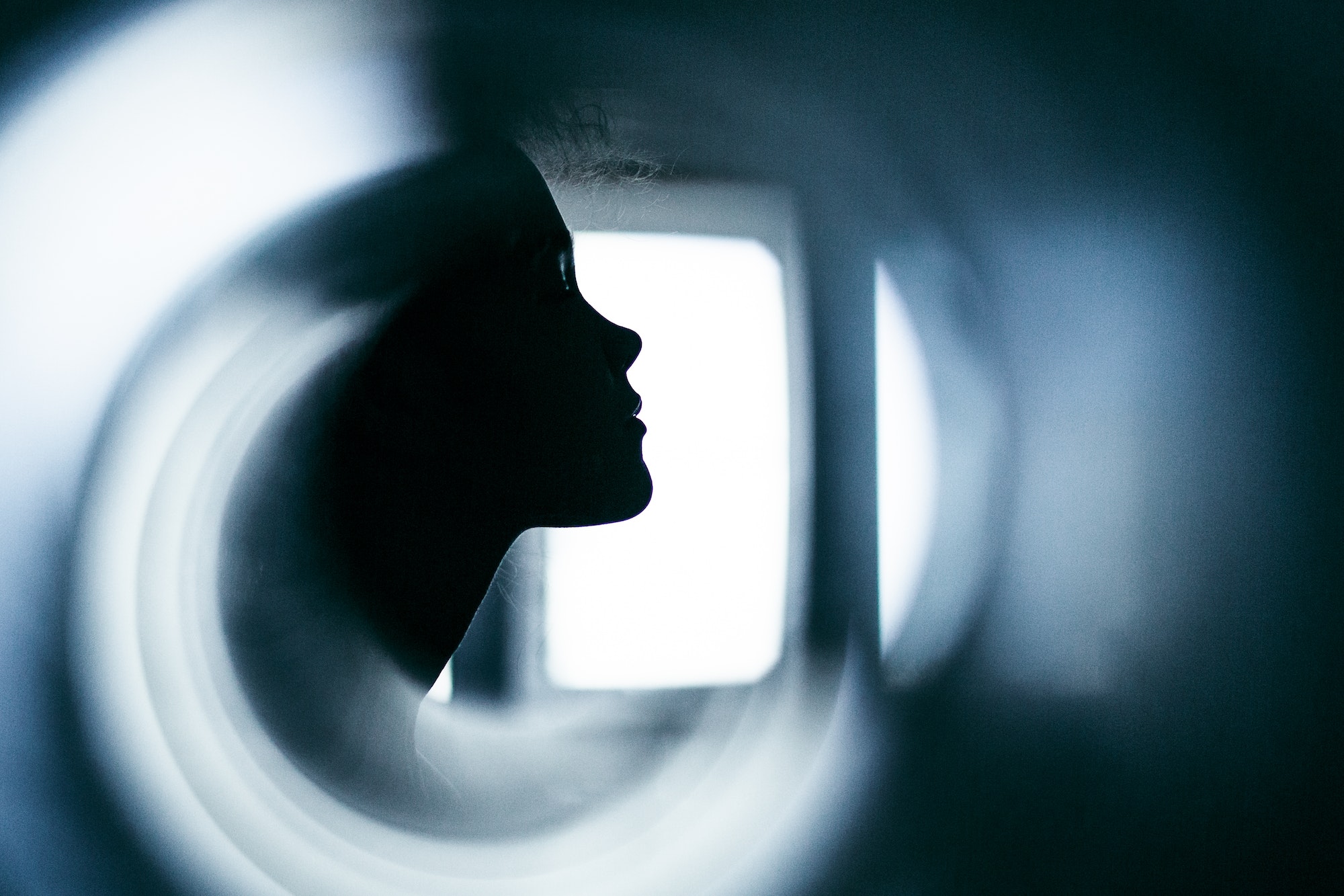 Portrait of a girl in profile. Abstract female portrait in blue tones