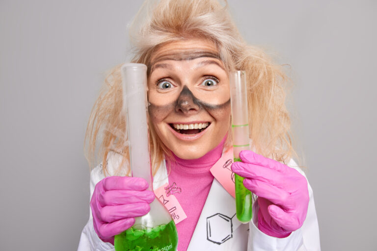 Cheerful scientist conducts experiment in laboratory shows mixture explosion studies science formula