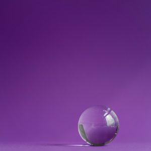 Crystal prism refracting light, magic crystals and pyramid, sphere and cube on purple background